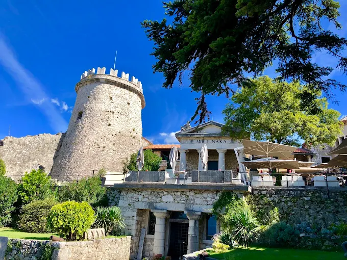 Trsat Castle Rijeka at golden hour with medieval stone fortress, Franciscan monastery, and panoramic Adriatic Sea views from hilltop in Croatia