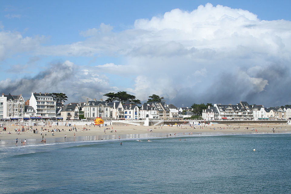 Quiberon peninsula with dramatic coastal cliffs, turquoise coves, and Belle Époque villas under golden Breton morning light in Brittany, France