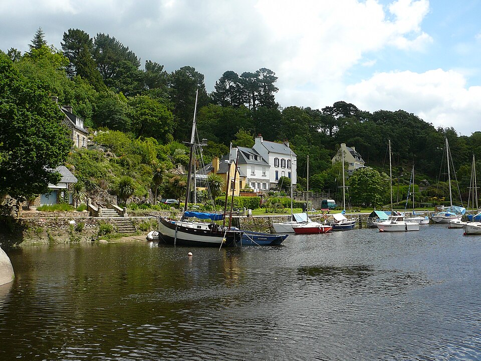 Pont-Aven art village with colorful half-timbered houses, Aven River waterfalls, and artist studios under soft Breton morning light in Brittany, France