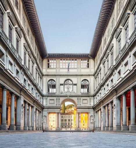 Uffizi Gallery in Florence at morning light, classical façade with statues lining the Loggia dei Lanzi nearby