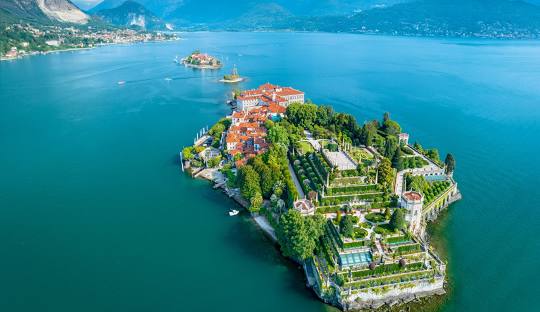 Lake Maggiore - Borromean Islands at golden hour, Isola Bella's Baroque palace and terraced gardens glowing under soft sunset light