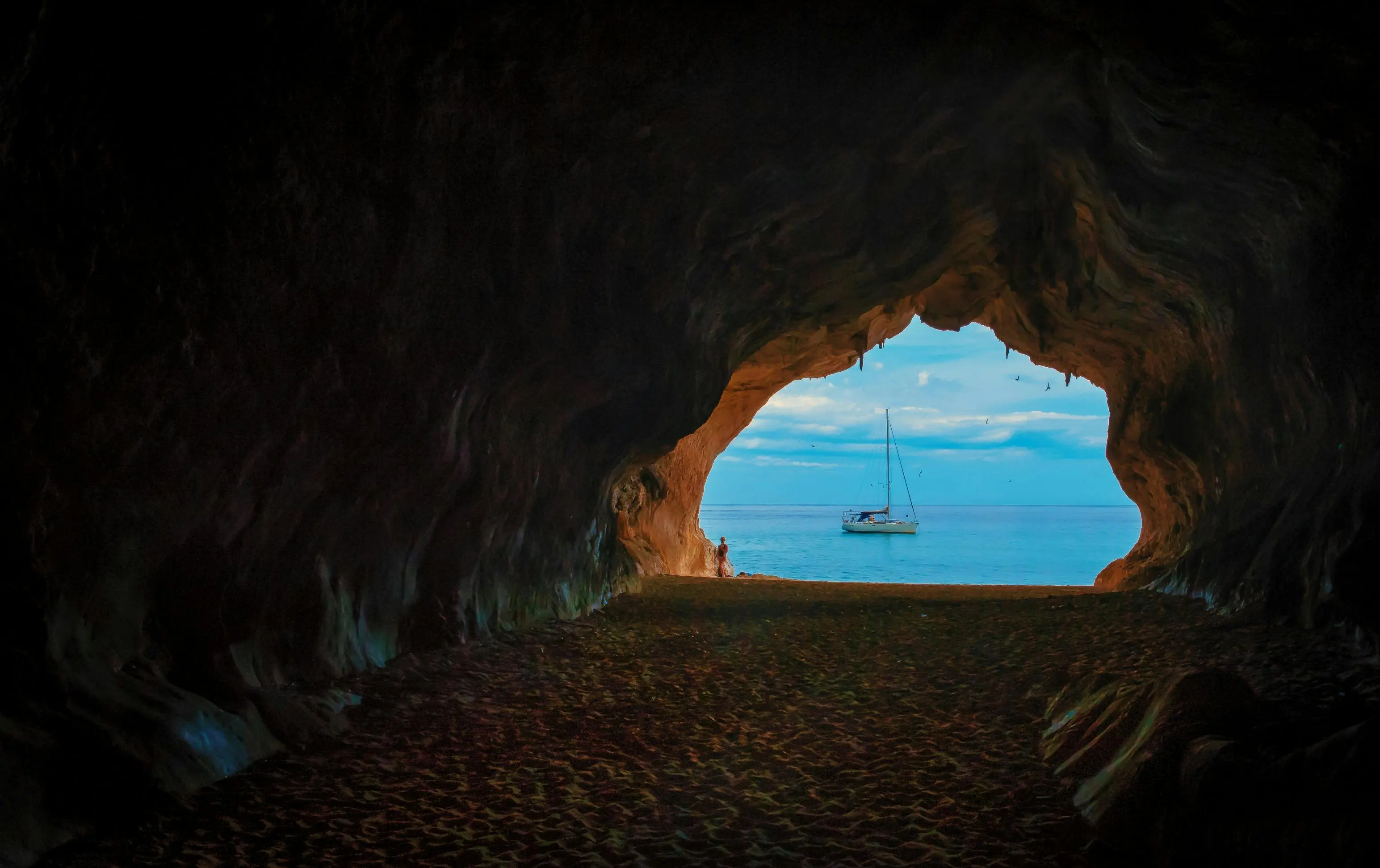 Nerja Caves spectacular limestone formations with stalactites and stalagmites illuminated by dramatic underground lighting in Málaga, Spain