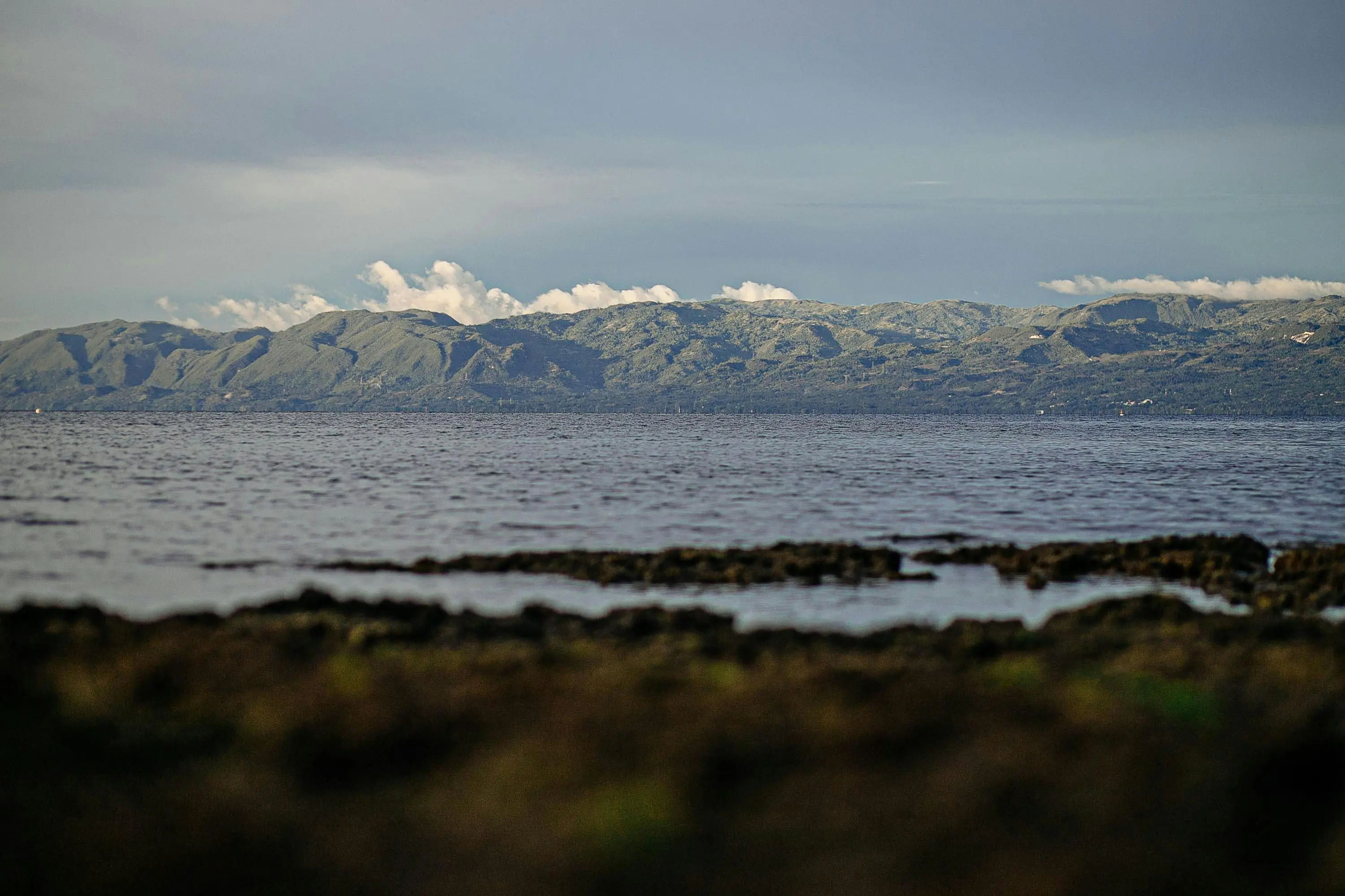 Galicia rías coastal inlets with fishing boats and green hills at golden hour in Pontevedra, Spain with misty Atlantic atmosphere
