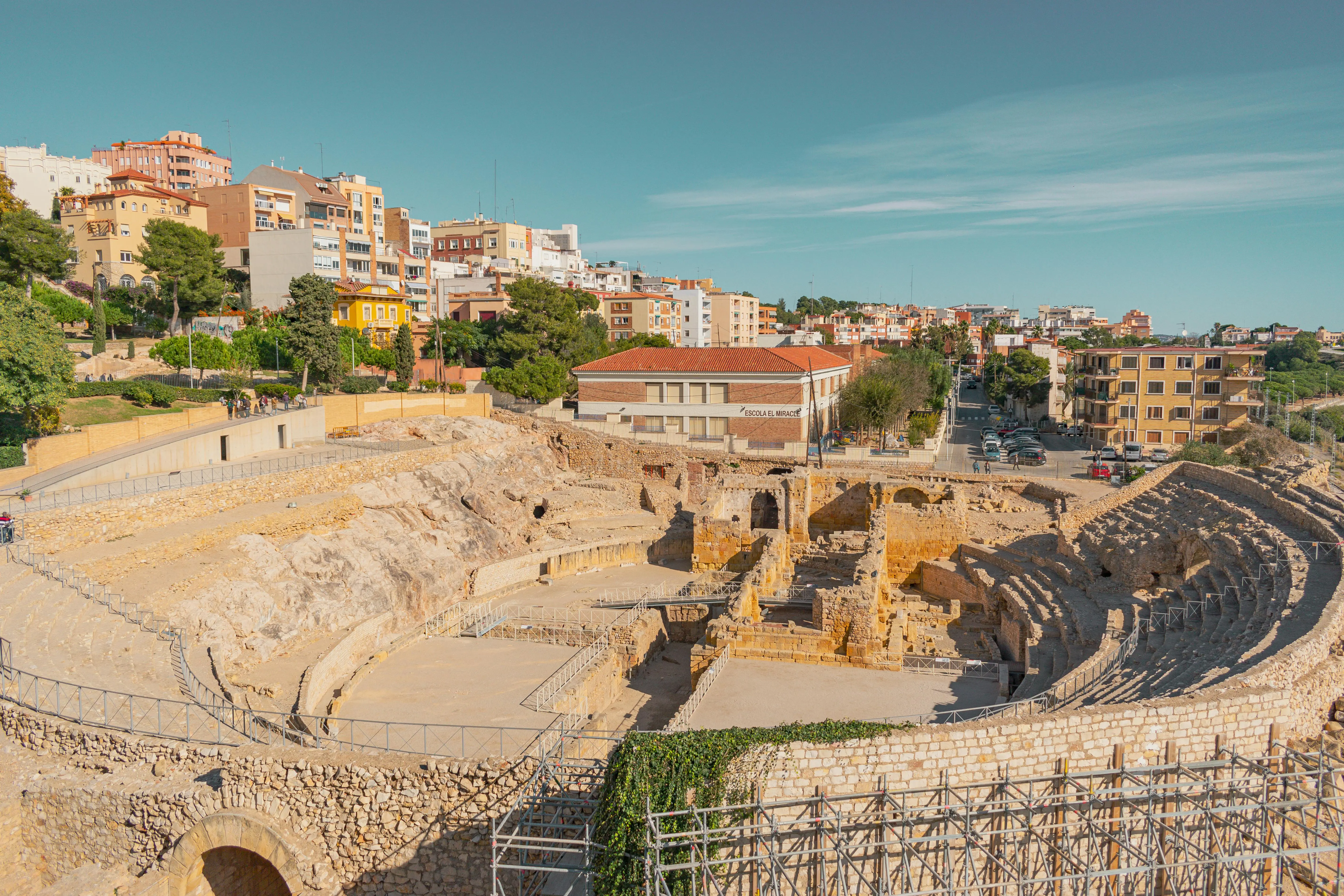 Tarragona Roman ruins amphitheatre at sunset with Mediterranean sea and stone arches, Catalonia, Spain