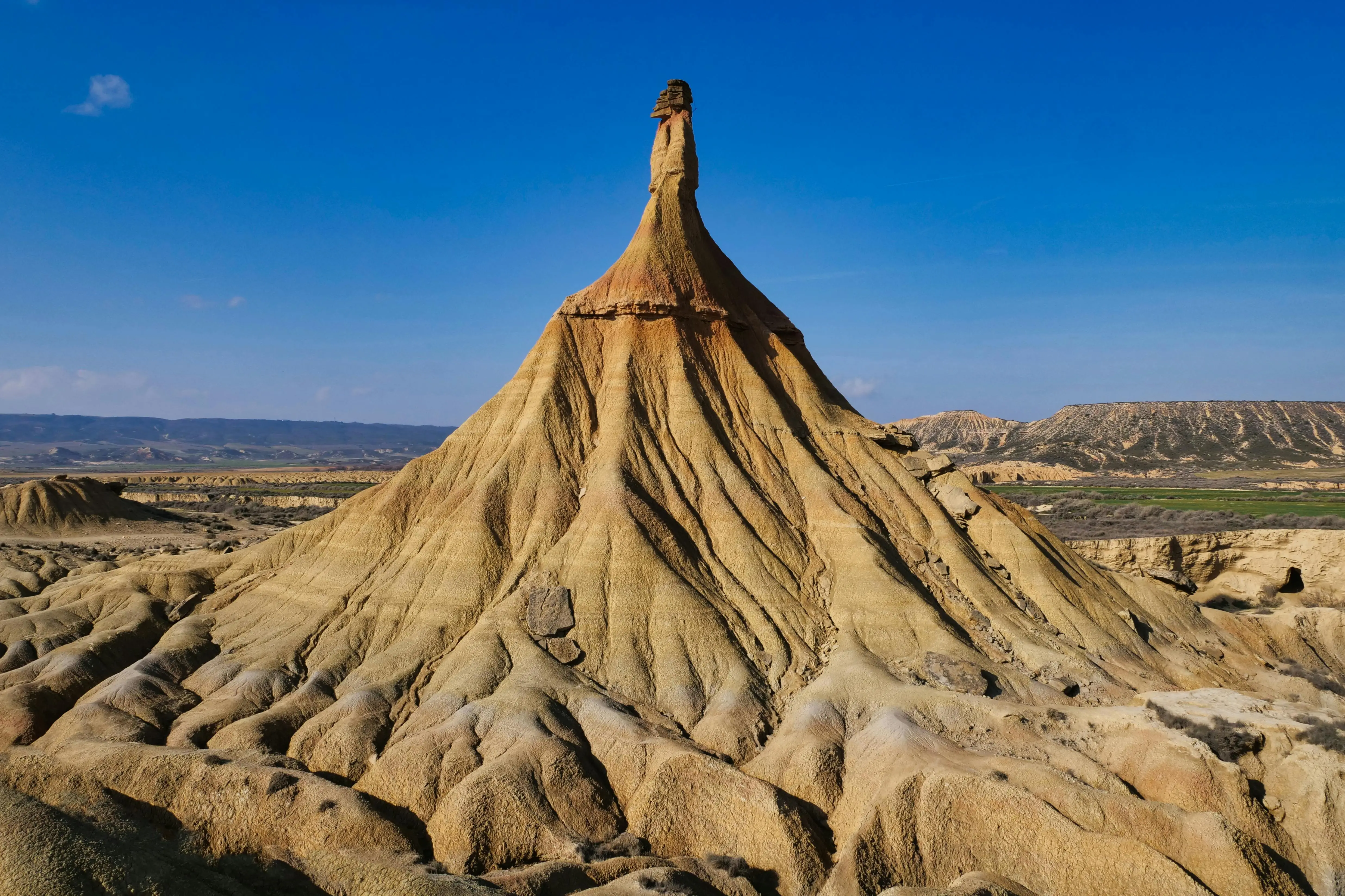 Bardenas Reales desert badlands at sunset with eroded sandstone formations and canyon landscapes, Navarra semi-desert natural park, Spain