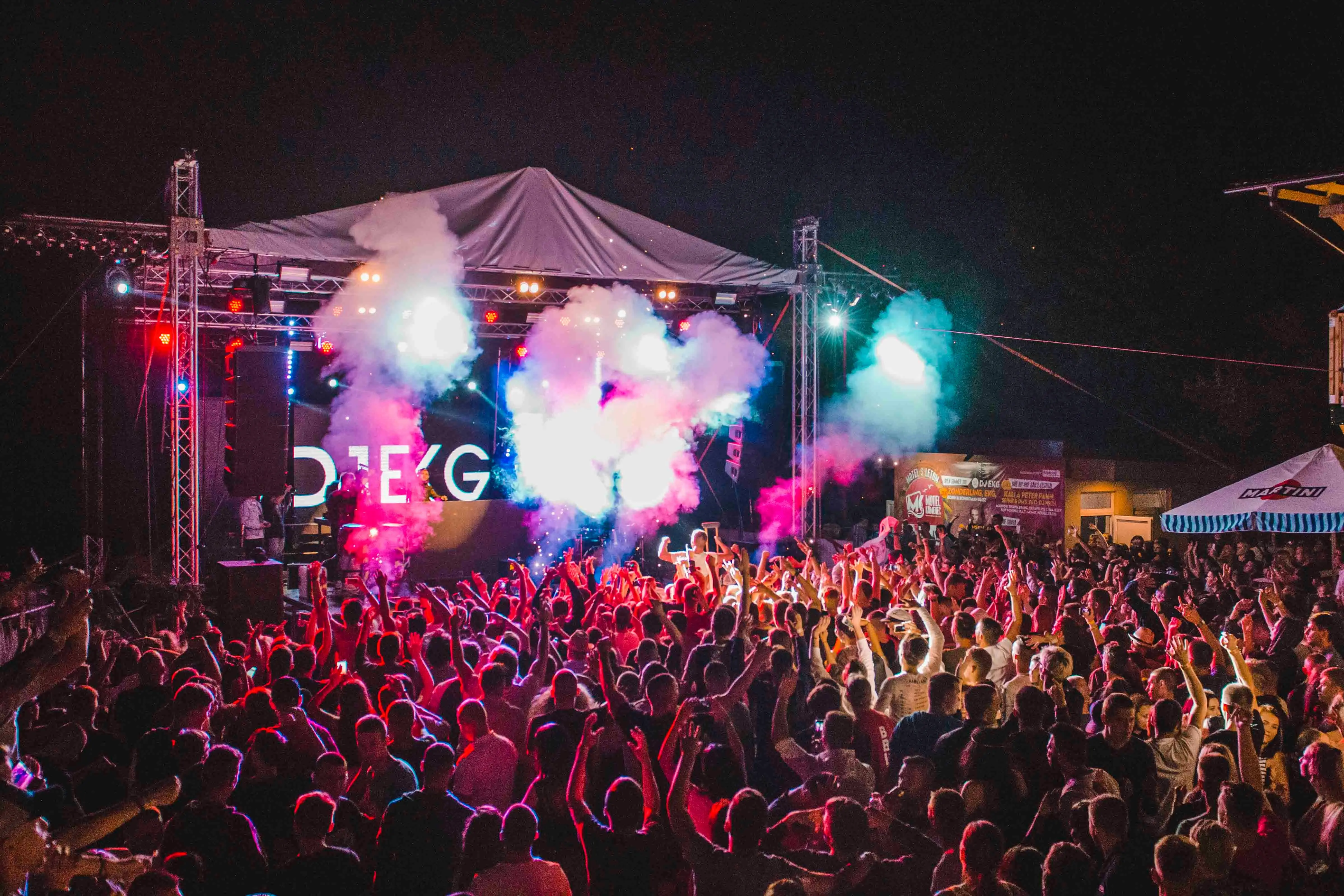 Benicàssim music festival stage at night with crowd and Mediterranean sea in background, Castellón, Spain
