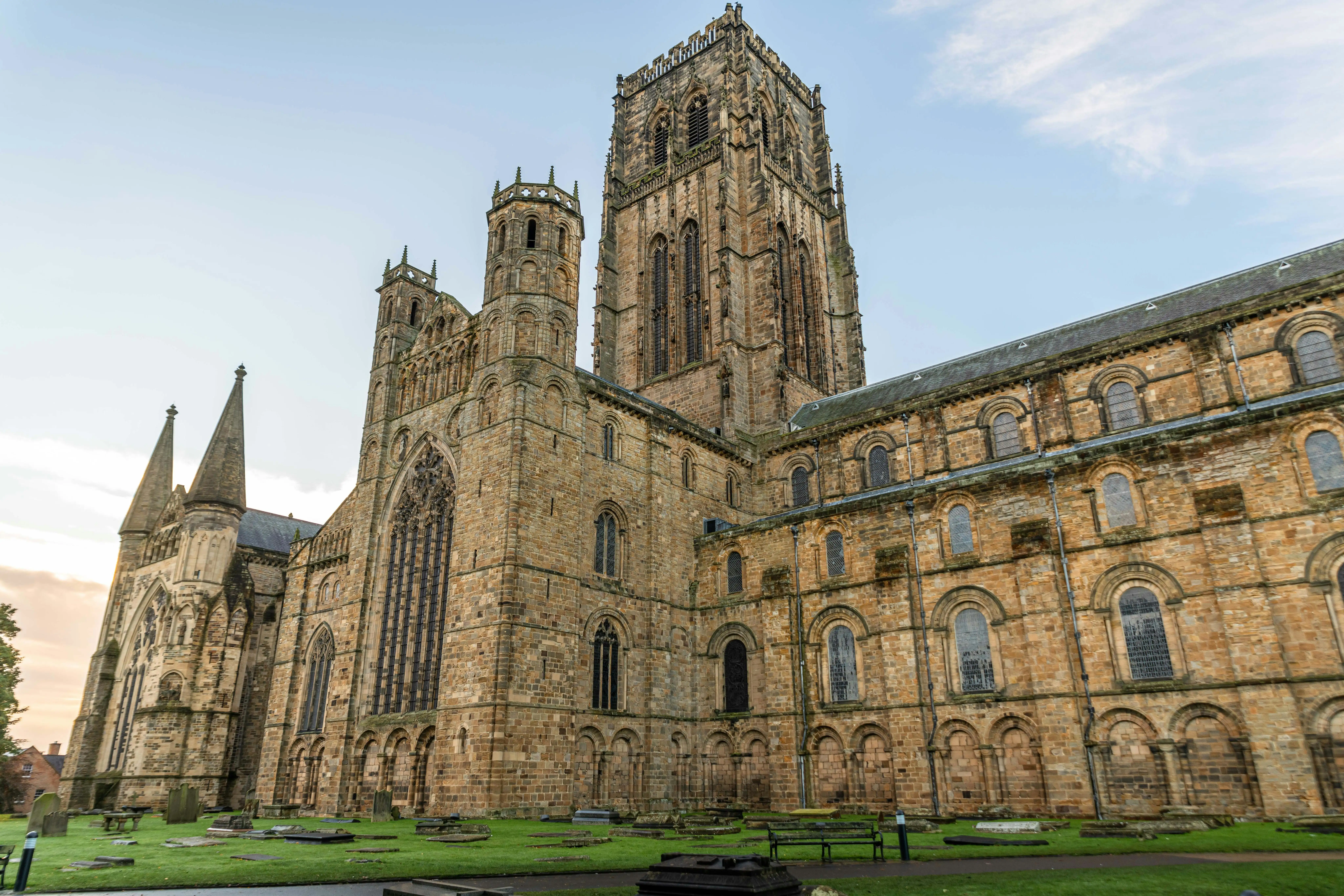 Durham Cathedral Norman architecture at sunrise with River Wear mist, stone towers, and ancient walls in County Durham