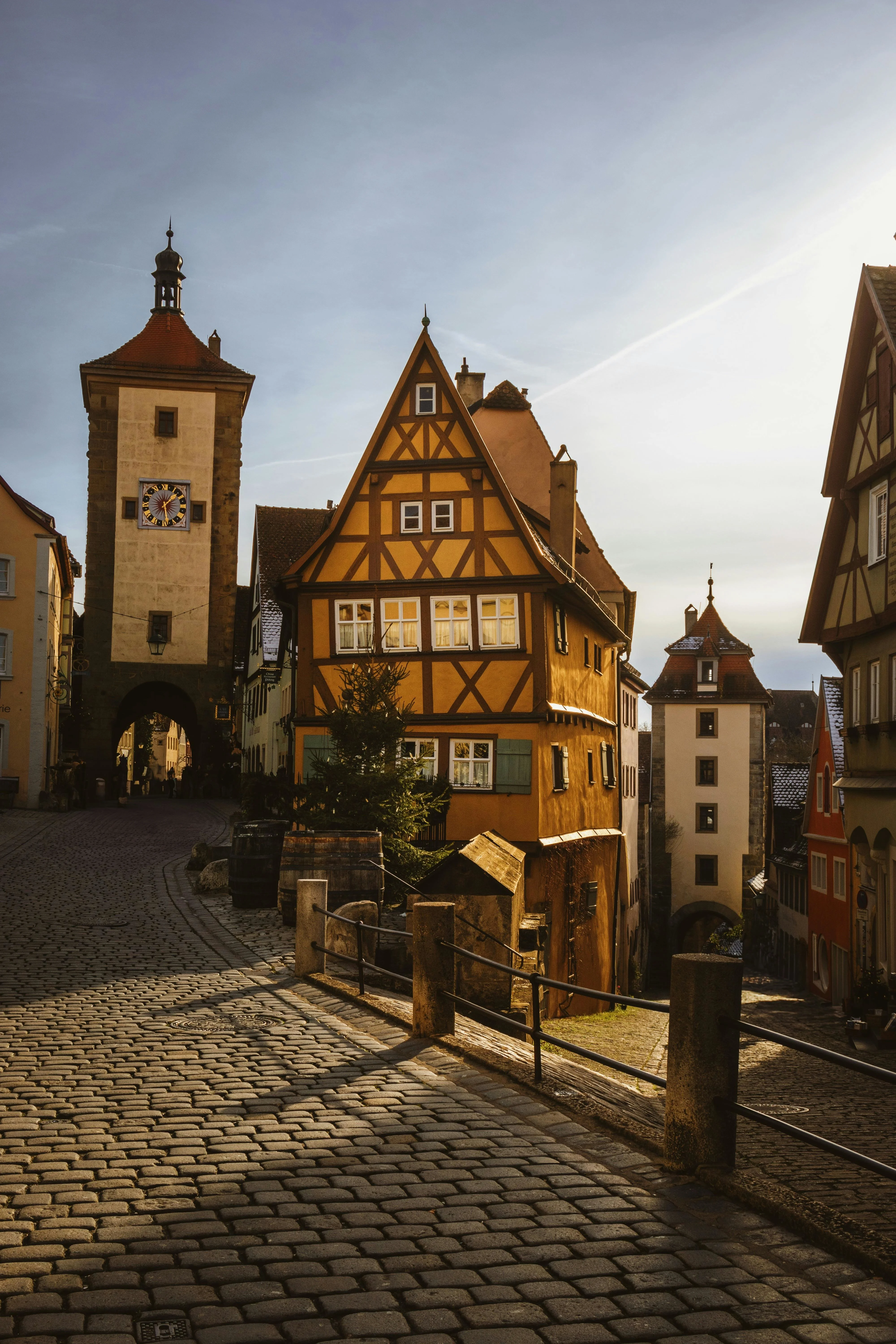 Half-timbered houses of Rothenburg ob der Tauber at sunrise with medieval walls and Tauber River valley in Bavaria Germany