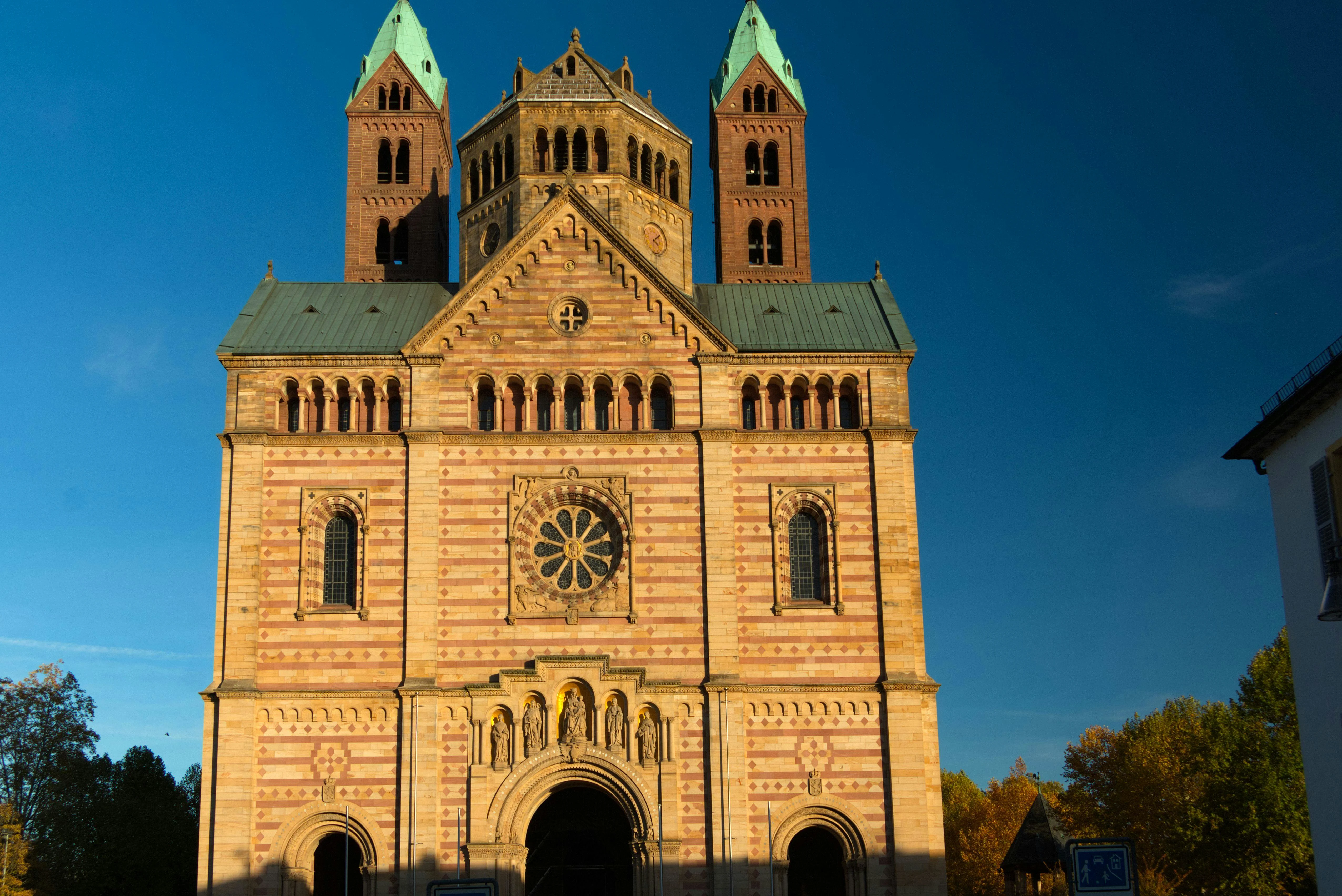 Speyer Cathedral red sandstone facade at sunrise with Rhine Valley mist, imperial domes, and historic towers in Germany