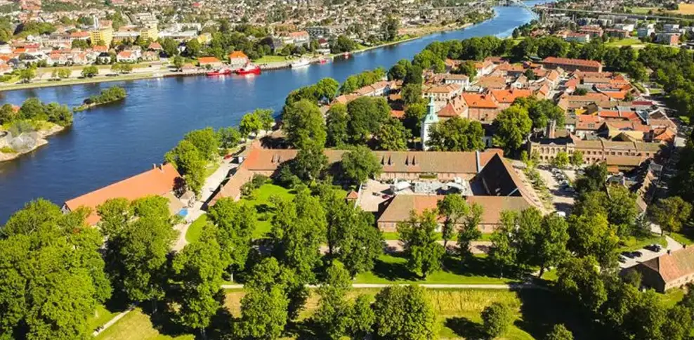 Fredrikstad fortress town Norway at sunset with cobblestone streets and historic wooden houses along river banks